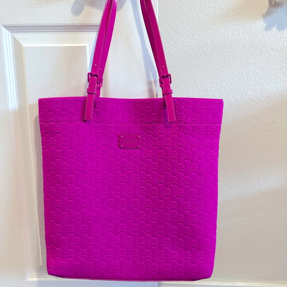 Michael Kors bright pink, has handles and also strap that comes off.